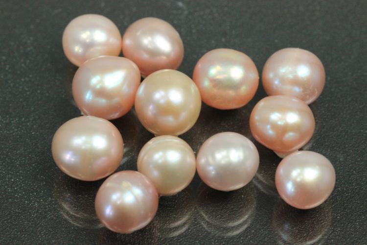 Freshwater pearl lot, undrilled, approx. dimensions 6.0mm to approx. 7.5mm, oval shape, color shades of plum.